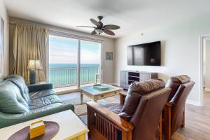 a living room with a view of the ocean at Splash Resort 907W in Panama City Beach