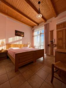 a bedroom with a large bed and a window at Appartment centrum in Karlovy Vary