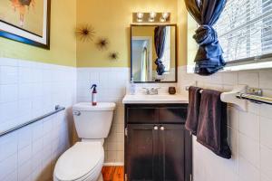 a bathroom with a toilet and a sink and a mirror at Peaceful Trenton Home with Patio Near Hiking! in Trenton +25 photos