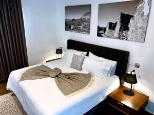 Postel nebo postele na pokoji v ubytování HOTEL MINA REAL