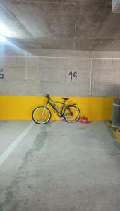 a bike is parked in a parking garage at Apartman Mia in Risan