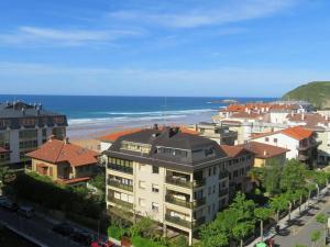 a view of a city with a beach and buildings at EGONA-ZUM8 Vista espectacular,piscina,tenis,playa in Zarautz