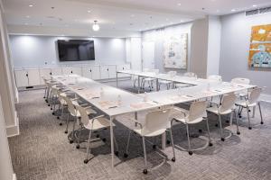 a conference room with a long table and chairs at Quirk Hotel Richmond in Richmond