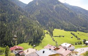 an aerial view of a village in a mountain at Ferienwohnung In Tiroler Stil in Kappl