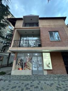 a building with posters on the front of it at Comfortable House the city center in Kutaisi