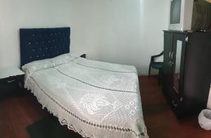 Postel nebo postele na pokoji v ubytování Hostal Perla Del Norte