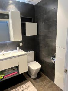 Koupelna v ubytování Apartamento moderno y acogedor ideal familias + 8 fotografií