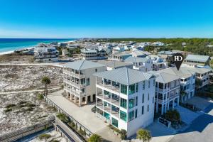an aerial view of a building with the ocean in the background at Kevin's Heaven in Grayton Beach