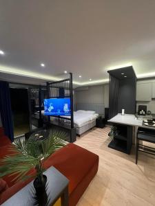 Postel nebo postele na pokoji v ubytování Prive Living Suite