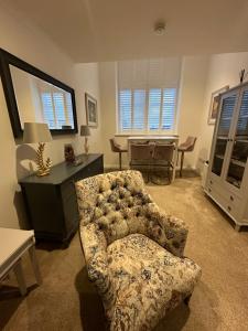 a living room with a chair and a desk at Luxury Moffat Apartment - High End Furnishing in Moffat
