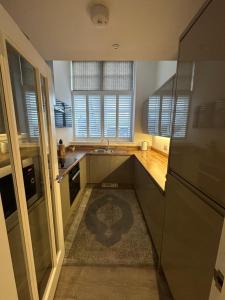 A kitchen or kitchenette at Luxury Moffat Apartment - High End Furnishing