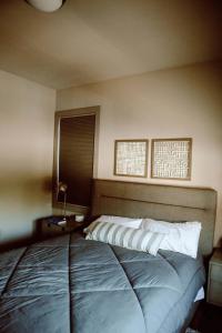 a bedroom with a large bed in a room at Modern State 209 Just Blocks Away From The Bay in Traverse City
