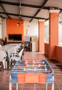 a ping pong table in the middle of a room at Hostal La Vidala in Tafí del Valle