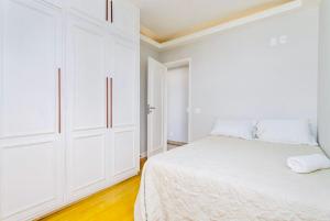Кровать или кровати в номере Maravilhoso apartamento na orla da Barra da Tijuca