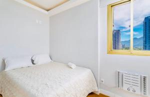 Кровать или кровати в номере Maravilhoso apartamento na orla da Barra da Tijuca