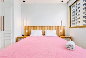 Кровать или кровати в номере Maravilhoso apartamento na orla da Barra da Tijuca