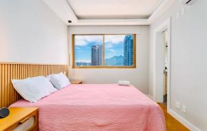 Кровать или кровати в номере Maravilhoso apartamento na orla da Barra da Tijuca