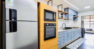 Кухня или мини-кухня в Maravilhoso apartamento na orla da Barra da Tijuca
