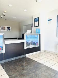 a waiting room with a cashier counter in a building at Motel 6-Santa Ana, CA in Santa Ana