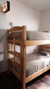 two bunk beds sitting next to each other in a room at El Sofá Caracas in Caracas