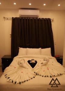 Ένα ή περισσότερα κρεβάτια σε δωμάτιο στο Great sphinx & pyramids HOTEL
