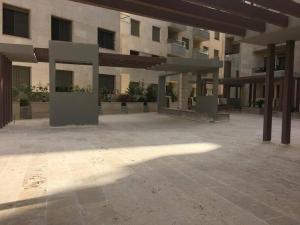 an empty courtyard of a large building at SAK Suites in Rujm ash Sharāʼirah