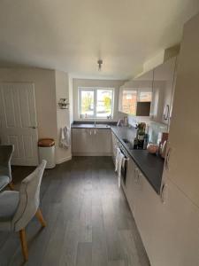 a kitchen with a sink and a counter top at 2 bedroom house in Seacroft