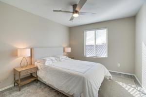 a bedroom with a bed and a ceiling fan at Goodyear Vacation Rental about 2 Mi to Spring Training in Goodyear