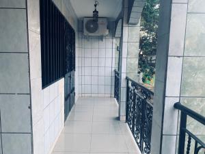 an empty hallway of a building with a balcony at Appartement meublé , Bonamoussadi, Douala-Vanguard's signature Suite in Douala