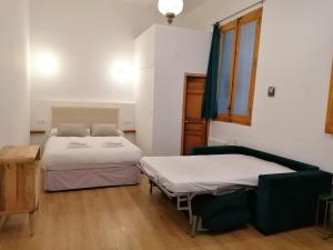 Llit o llits en una habitació de Apartamento de diseño Malasaña