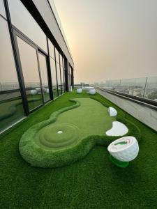 a miniature golf course on the roof of a building at Deluxe Studio Apartments at Kass Towers Accra - Upper Floor By VP Properties in Accra