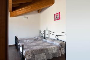 Ένα ή περισσότερα κρεβάτια σε δωμάτιο στο Affittacamere La Palazzina