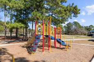 a playground with a slide in a park at Harbourside Hideout in New Bern