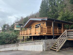 a house on a hill with a staircase leading to it at Chalet du Faubourg & Jacuzzi, proximité Gerardmer & La Bresse in Rochesson