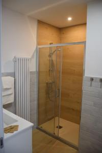 a shower with a glass door in a bathroom at Casa Fornace in Ala +47 photos