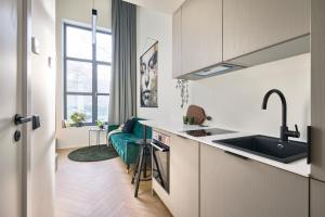 Kuchyň nebo kuchyňský kout v ubytování 21 Stylish Lofts by Dream Stay