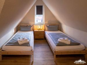 เตียงในห้องที่ Auszeit-im-Harz Haus 1 Wohnung Brockenspitze