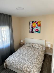 Postel nebo postele na pokoji v ubytování Pisito de la Lola Flores
