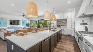 a kitchen with a large white counter top in a room at Shaker of Salt in Siesta Key