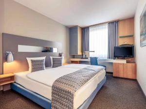 Postel nebo postele na pokoji v ubytování Mercure Hotel Düsseldorf City Nord