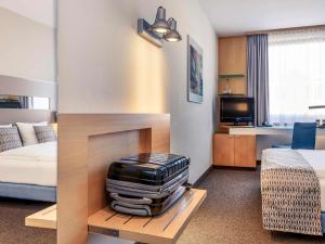Postel nebo postele na pokoji v ubytování Mercure Hotel Düsseldorf City Nord