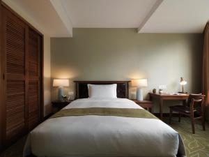 Letto o letti in una camera di Yusense Hotel