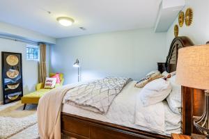 a bedroom with a bed and a couch in a room at Pet-Friendly DC Area Condo with Yard! in Silver Spring
