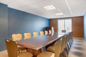 a conference room with a long table and chairs at Comfort Inn & Suites Danbury-Bethel in Danbury