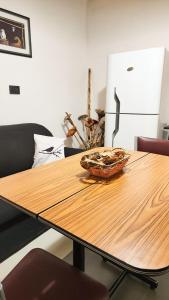 a wooden table with a bowl on top of it at Departamento DORREGO, A estrenar in Guaymallen