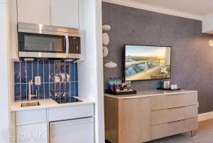a kitchen with a counter with a microwave at FontaineBleau Resort High Floor w Ocean Views in Miami Beach