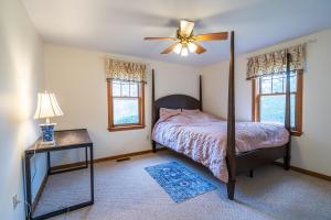 a bedroom with a bed and a ceiling fan at Cozy Cape Classic-Central AC&Near Bay Beaches in Barnstable