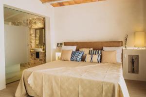 Ένα ή περισσότερα κρεβάτια σε δωμάτιο στο Can Solaies