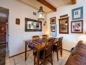 a dining room with a table and chairs at Cielo Grande 303, 2 Bedrooms, HDTV, Pet Friendly, Sleeps 6 in Santa Fe
