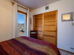 a bedroom with a bed and a sliding glass door at Cielo Grande 303, 2 Bedrooms, HDTV, Pet Friendly, Sleeps 6 in Santa Fe